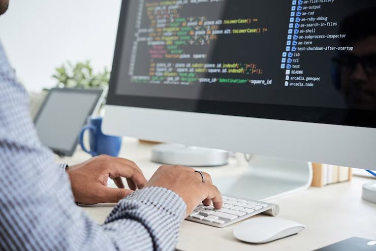 An engineer in the process of custom application development